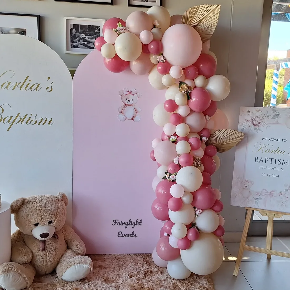 Pink balloon garland baptism backdrop styled by Fairylight Events