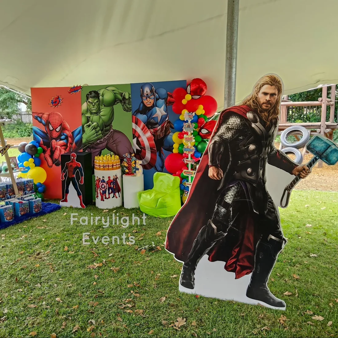 Avengers-themed birthday backdrop with life-size Thor cutout, styled by Fairylight Events