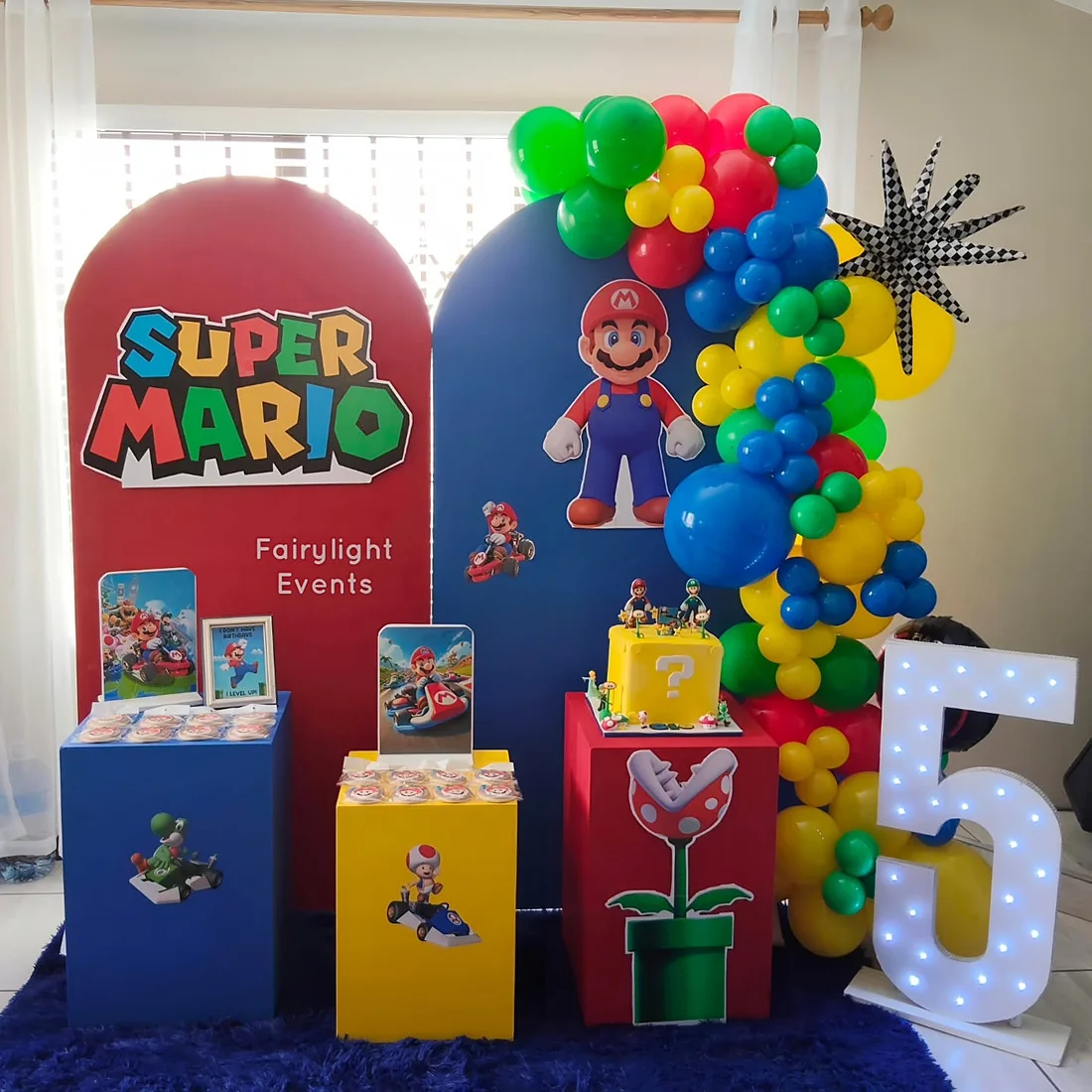 Super Mario themed birthday backdrop and balloon garland by Fairylight Events