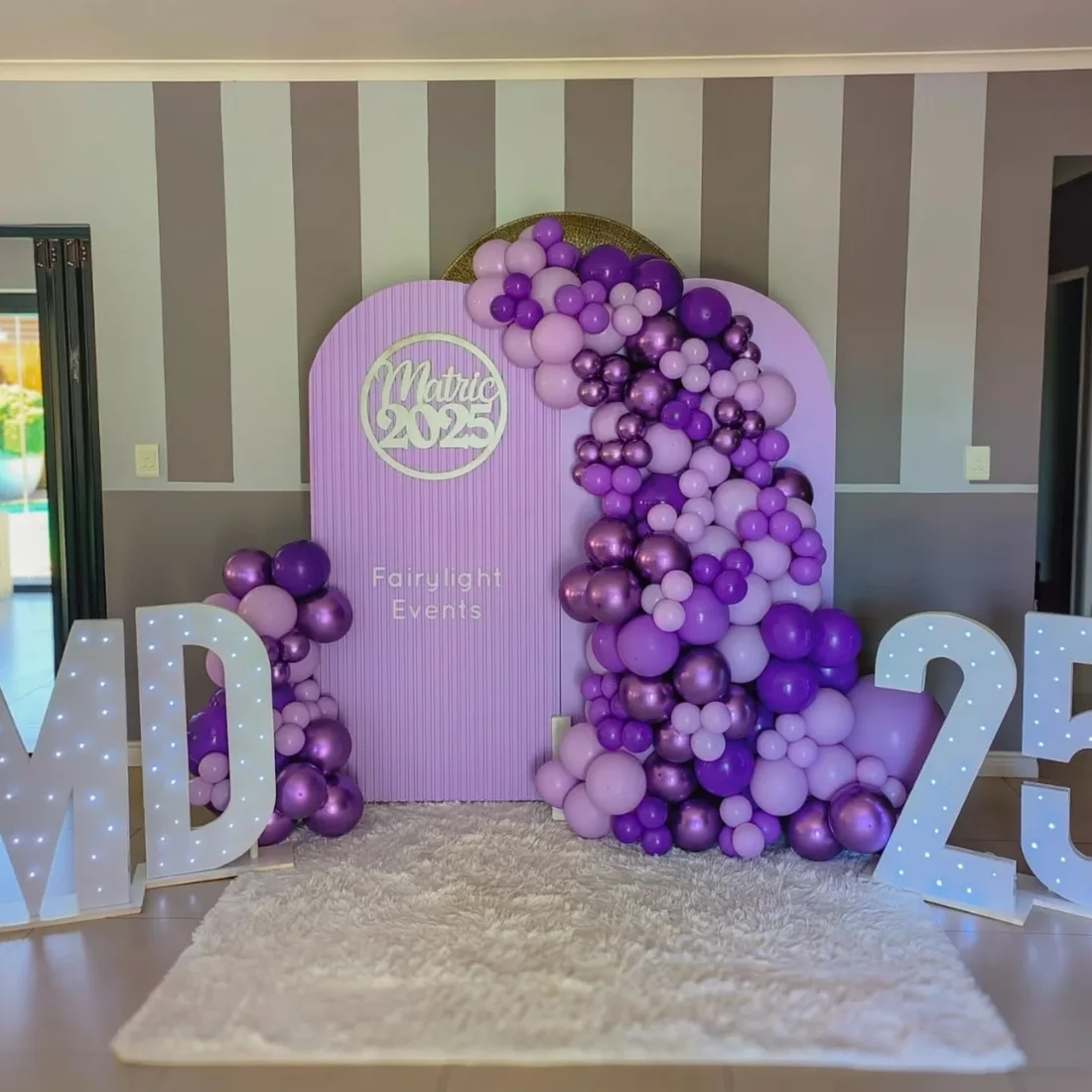 Purple chrome balloon garland matric backdrop by Fairylight Events